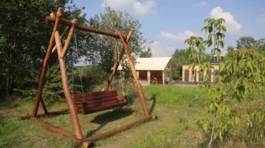 Budget glamping for family outdoor recreation. Glamping terrace in the forest. Glamping houses, rural landscape, tent houses.
