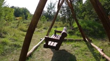 Budget glamping for family outdoor recreation. Glamping terrace in the forest. Glamping houses, rural landscape, tent houses.