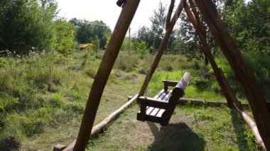 Budget glamping for family outdoor recreation. Glamping terrace in the forest. Glamping houses, rural landscape, tent houses.