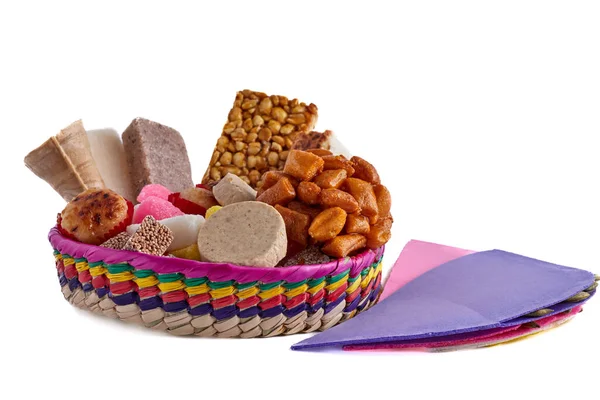 Basket with traditional Mexican sweets. Mueganos, ate squares, marzipans, peanut crowns, coconut candy, amaranth candy, cocadas, borrachitos, sevillanas.