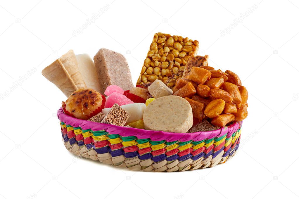Basket with traditional Mexican sweets. Mueganos, ate squares, marzipans, peanut crowns, coconut candy, amaranth candy, cocadas, borrachitos, sevillanas.