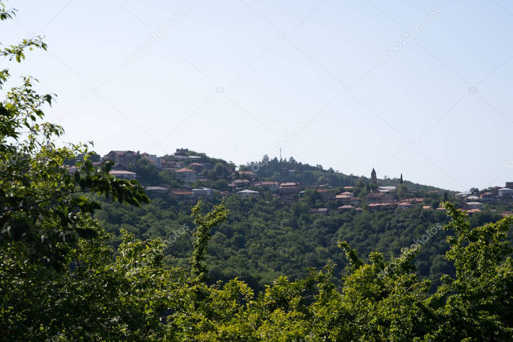 view of the city from the hill in the evening when the sea is quite dark there can be seen the roofs of buildings