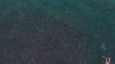 Beautiful texture of big power dark ocean waves with white wash. Aerial top view footage of ocean waves.