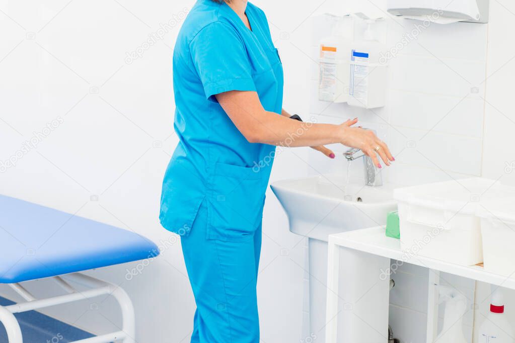 hand washing and sanitizer disinfection. The doctor is preparing to receive patients