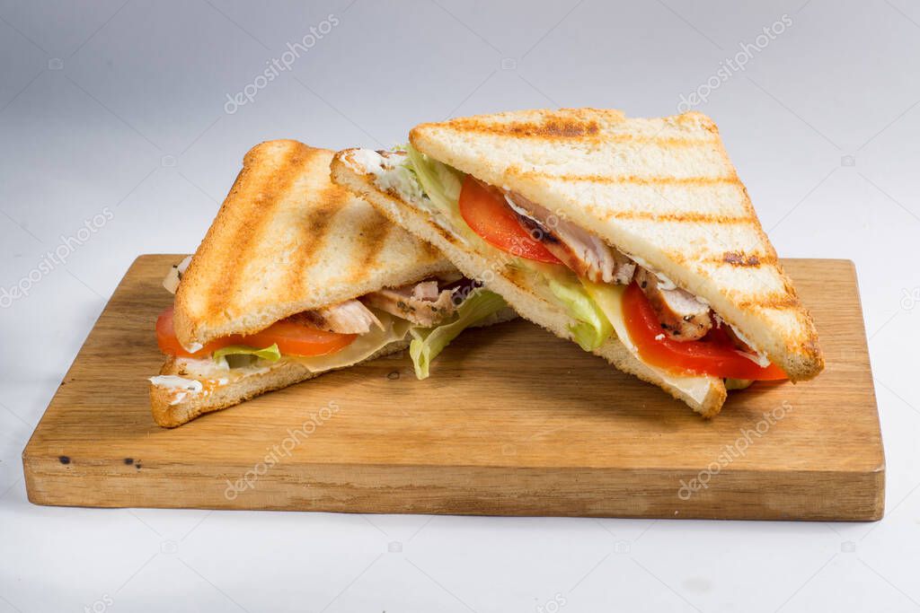 sandwiches on a wooden board
