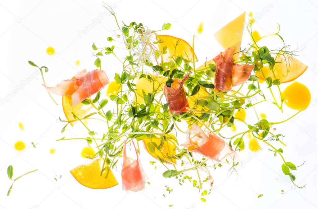 Salad, vegetables and meat on a white background, on a light table