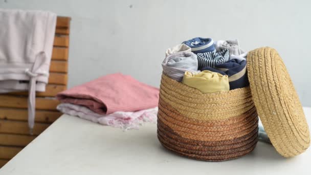 Woman Puts Clothes Laundry Basket Sustainable Living Sorting Second Hand — Stock Video