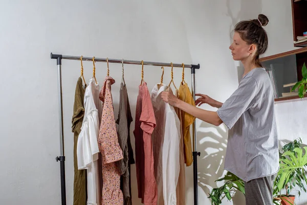 Woman Hangs Clothes Rail Home Sorting Wardrobe Second Hand Concept — Stock Fotó