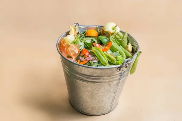 Sorted organic kitchen waste in compost-bucket. Sustainable life style concept. Compost-container. Peels, scraps from food preparation collected for recycling, humus and natural fertilizer