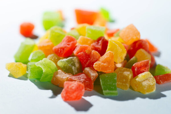 Sweet colored candied fruits are very close. Poured many colorful candies