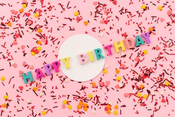 Happy birthday inscription from wooden letters with sweet sprinkle — Stock Photo, Image