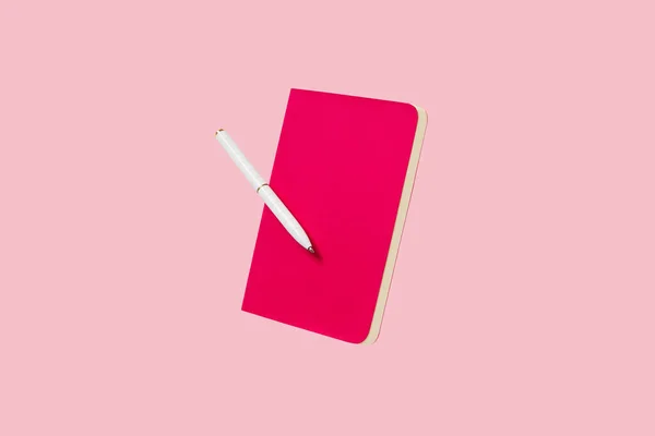 Office supplies stationery levitate on pink background. Back to school business education creative layout