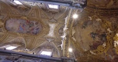 Roman church ceiling: Santa Maria dell'Orto. Luxurious interior design with paintings, sculptures and frescoes. Renaissance and Baroque architectural style.