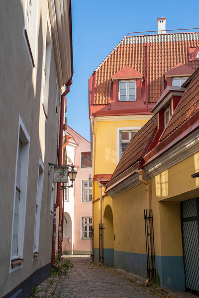 Empty narrow Rahukohtu street in Tallinn Old Town on a sunny autumn day.