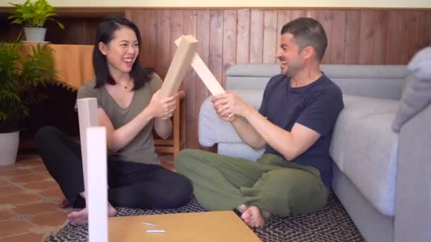Multiracial Couple Assembling Table Rug House — Stock Video