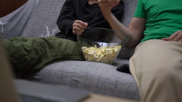 Cropped Unrecognizable Couple Wearing Casual Clothes Sitting Couch Eating Popcorn — Stock Video