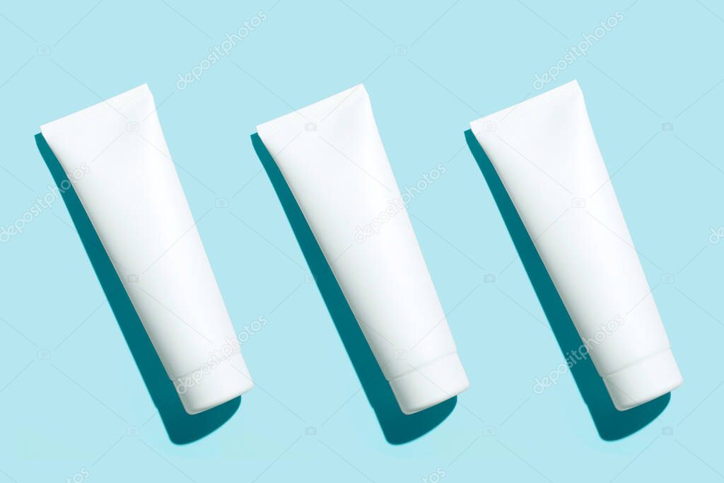 Tube For Cream or Toothpaste Mock Up Set on blue background. High quality photo