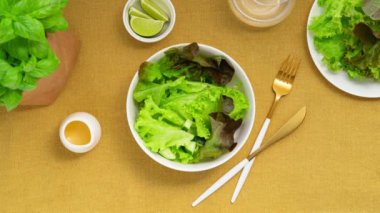 Vegetable salad with salted salmon in a white bowl.Top view. Stop Motion Animation.