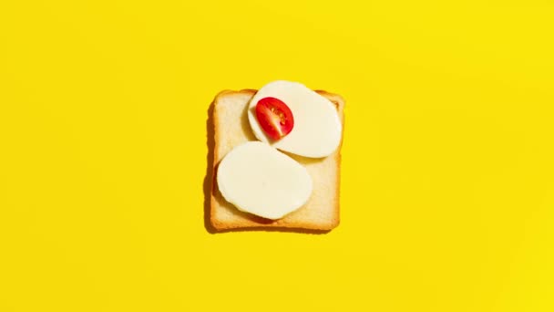 Toast Tomatoes Mozzarella Cheese Basil Yellow Background Stop Motion Animation — Vídeos de Stock