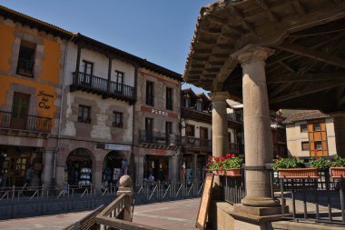 POTES, CANTABRIA, SPAIN, JULY 11, 2022: Views of the medieval town of Potes, Cantabria, Spain. Capitan Palacios Square.Old stone facades.Famous tourist destination in the Picos de Europa National Park