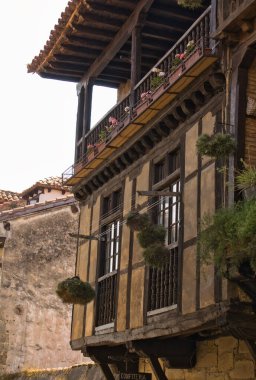 Old facades and windows in the old town of San Vicente de la Barquera in Cantabria, Spain.
