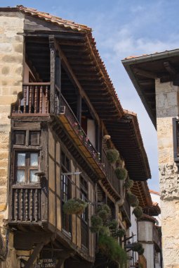 Old facades and windows in the old town of San Vicente de la Barquera in Cantabria, Spain.