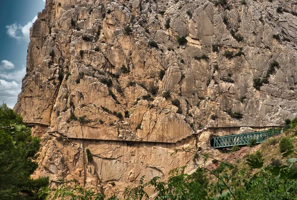 Wooden structure on the mountain to save the precipice and not fall into the void. Great rock block for climbing. Famous Caminito del Rey in Malaga, Spain. Copy space