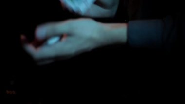 footage of croupier shuffling cards in hands 