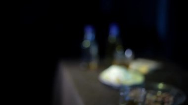 footage of man showing three King Cards on dark background 