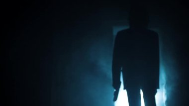 Cinematic shot of a serial killer in a suit coming out of the door and shooting with smoke and dramatic lighting. 