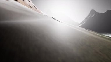 Cinematic drone shot of mountains with some clouds and sunlight. 4K 60FPS. 3d Render.
