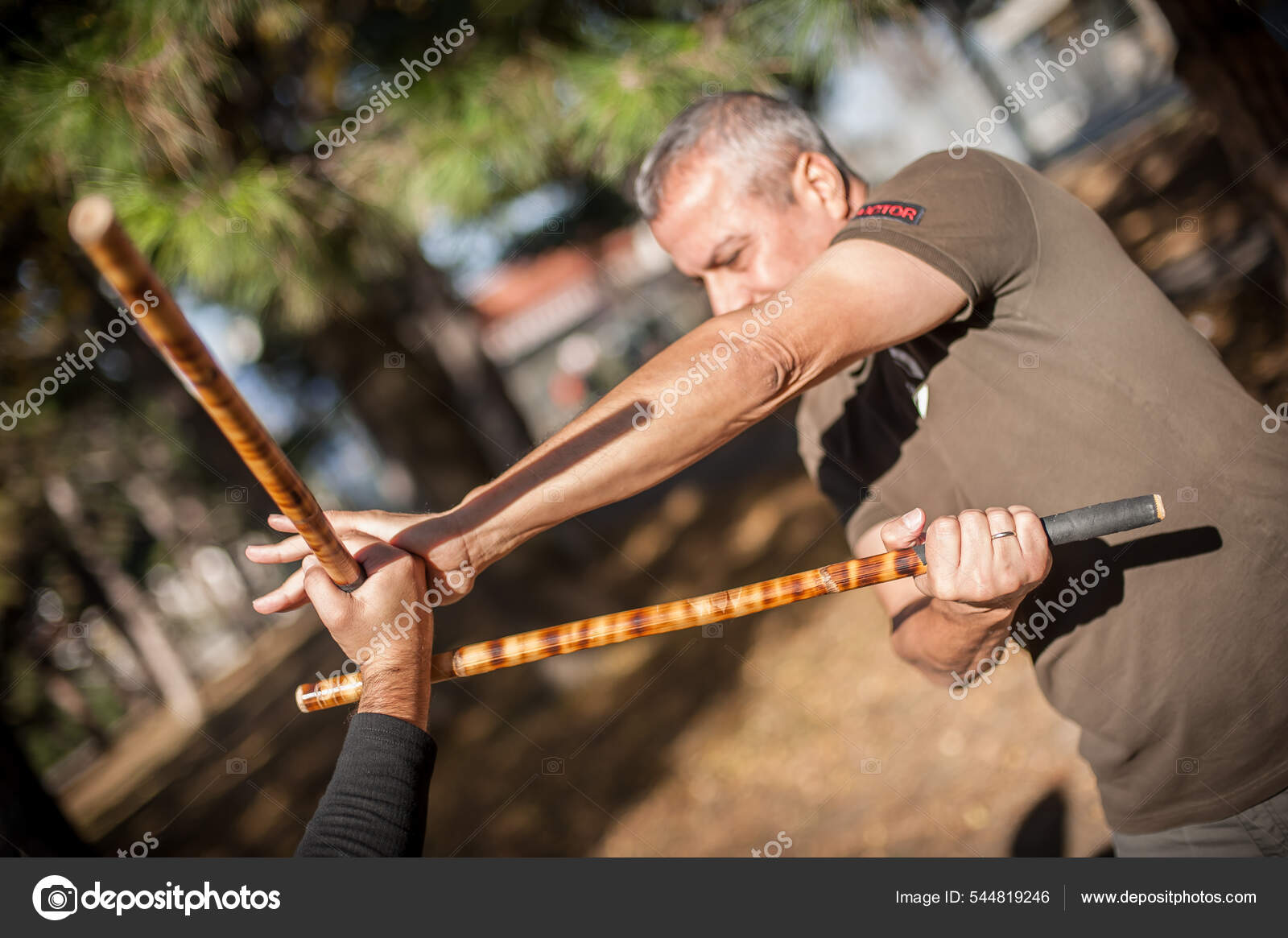 Escrima and kapap instructor demonstrates sticks fighting