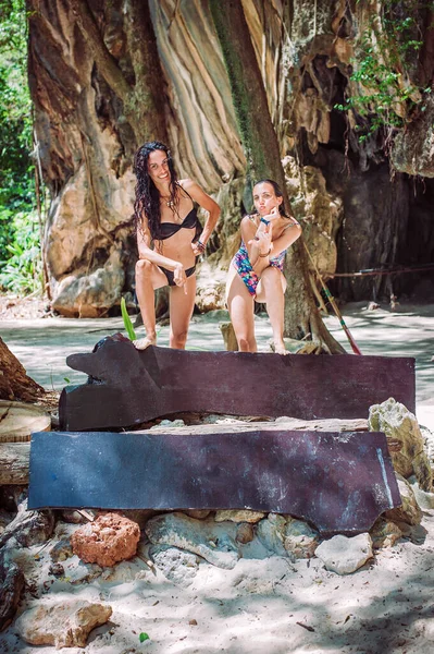 Two Young Women Show Two Empty Wooden Boards Forest Beach — Stockfoto