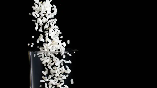 White Rice Poured Glass Splash — Stockfoto