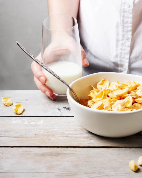 Bowl of corn flakes with milk for breakfast.