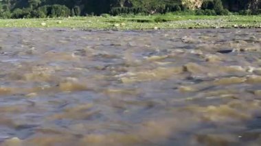 Fast flowing raging flood in river swat, Pakistan.