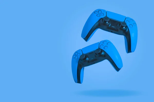 Blue Game Controllers Blue Background — Fotografia de Stock
