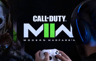 Man playing Call of Duty Modern Warfare II on TV screen. 22 Sep, 2022, Sao Paulo, Brazil. clipart