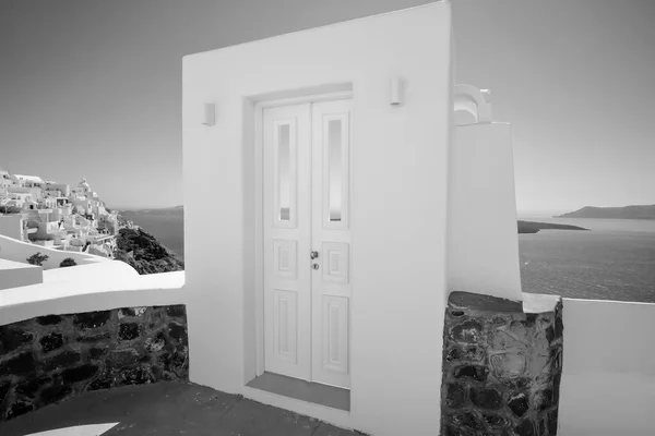 Traditional white architecture and door overlooking the