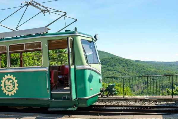 Knigswinter, Germany- May 18, 2022 : View of the vintage green tram train in Drachenfels Germany