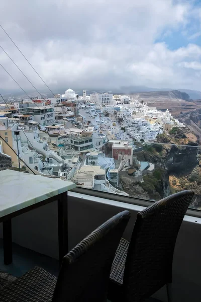 Amazing panoramic view from a restaurants terrace over the Aegean Sea in Fira Santorini