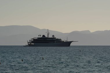 Ios, Greece : June 10, 2021 - View of a luxury Yacht and water sport activity at the famous Mylopotas beach of Ios