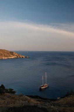 View of a beautiful yacht  at the beach of Mylopotas in Ios  Greece