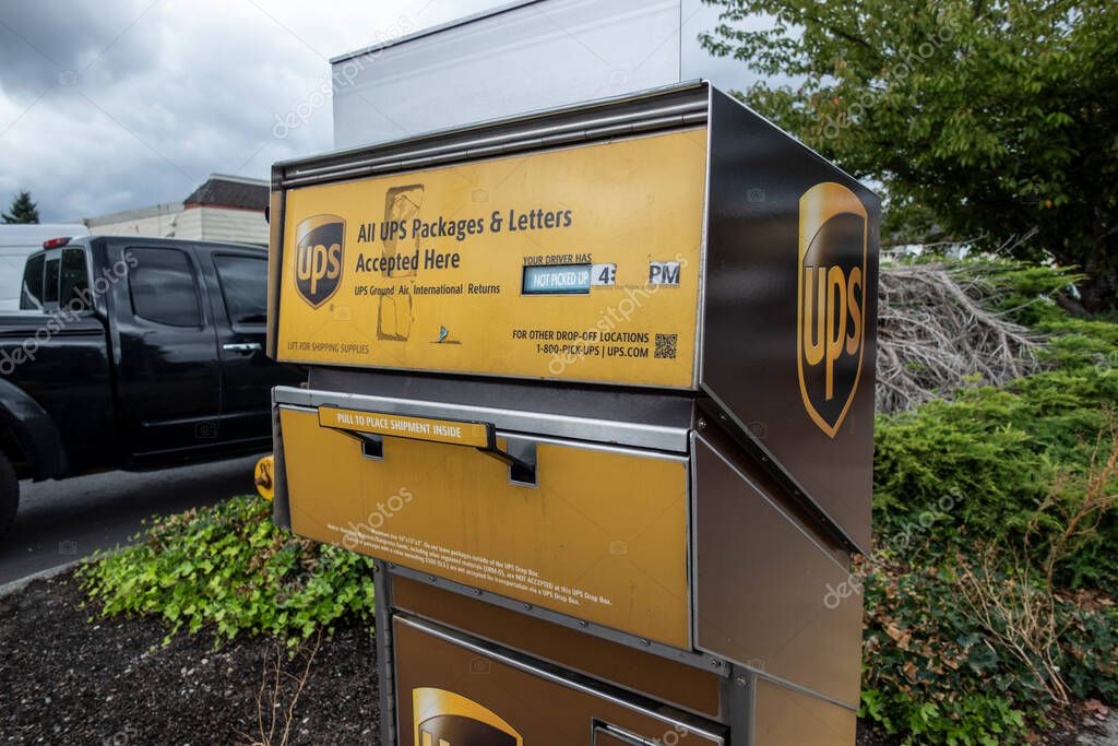 Woodinville, WA USA - circa September 2021: Angled view of a UPS package and letter deposit station in downtown Woodinville.