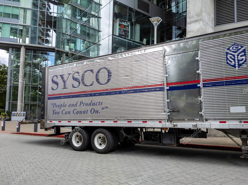 Bellevue, WA USA - circa June 2021: View of a Sysco Foods truck outside of a restaurant, making a delivery.