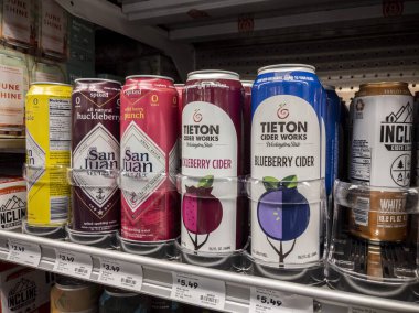 Mill Creek, WA USA - circa April 2022: Angled, selective focus on alcoholic seltzers and ciders for sale inside a grocery store.
