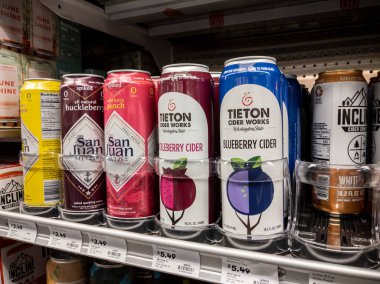 Mill Creek, WA USA - circa April 2022: Angled, selective focus on alcoholic seltzers and ciders for sale inside a grocery store.