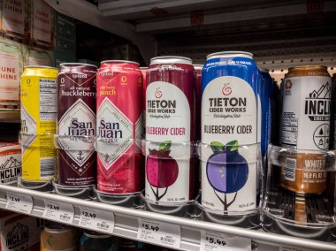 Mill Creek, WA USA - circa April 2022: Angled, selective focus on alcoholic seltzers and ciders for sale inside a grocery store.