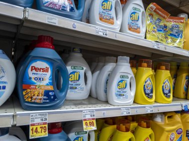 Kirkland, WA USA - circa September 2021: Angled view of a variety of laundry detergents for sale inside a Safeway grocery store.
