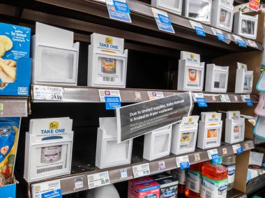 Lynnwood, WA USA - circa May 2022: Angled view of bare shelves during a baby formula shortage inside a QFC grocery store.